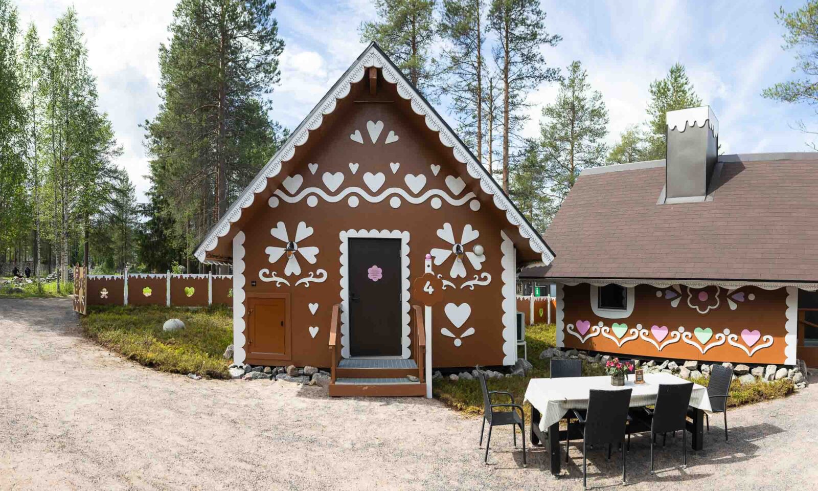 A large gingerbread cabin in summer at Santa Claus Village, Rovaniemi.