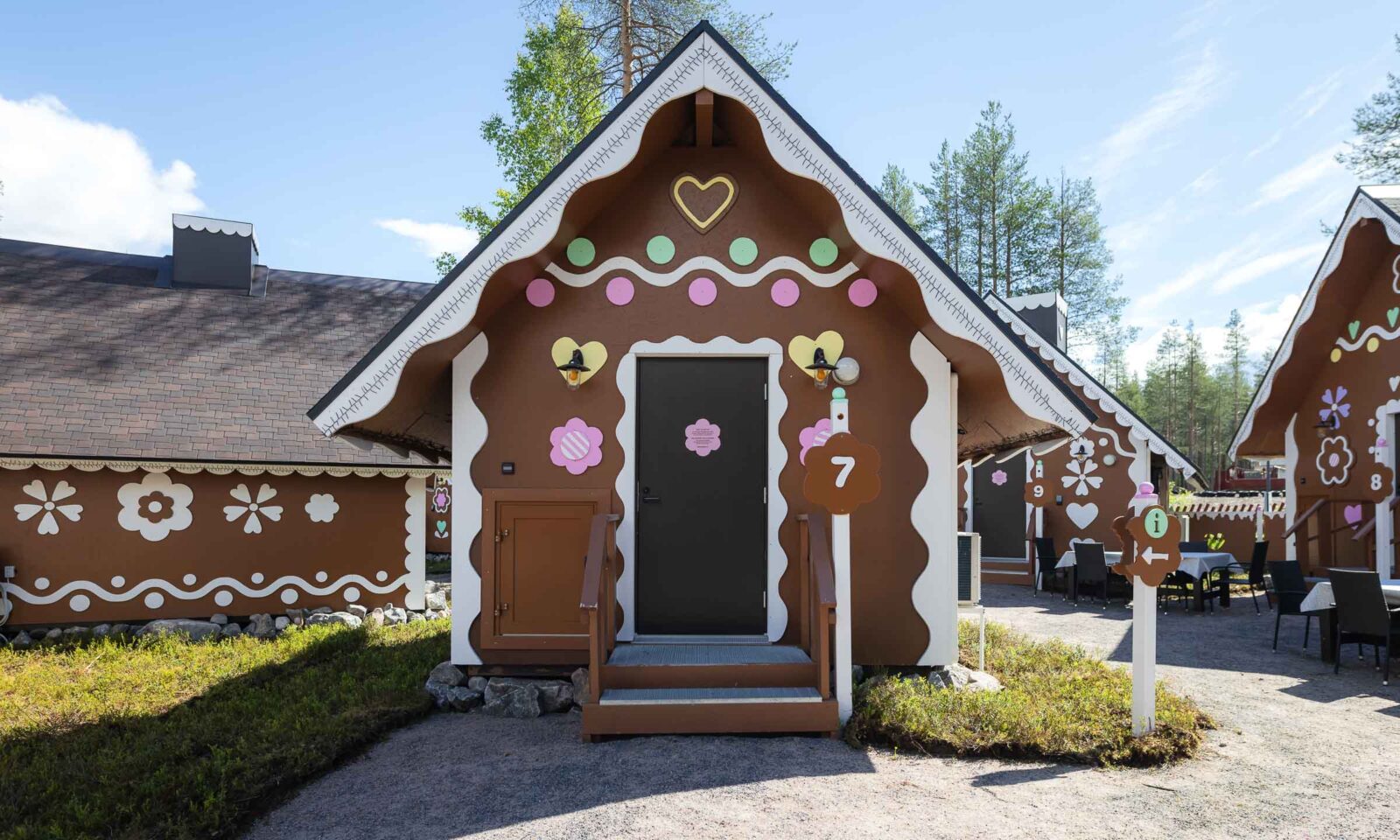 A small gingerbread cabin in summer at Santa Claus Village, Rovaniemi.