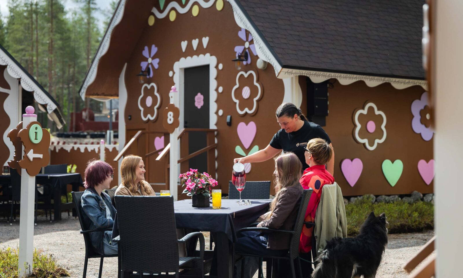 A group of friends enjoying time at Piparina Summer restaurant in Santa Claus Village, Rovaniemi.